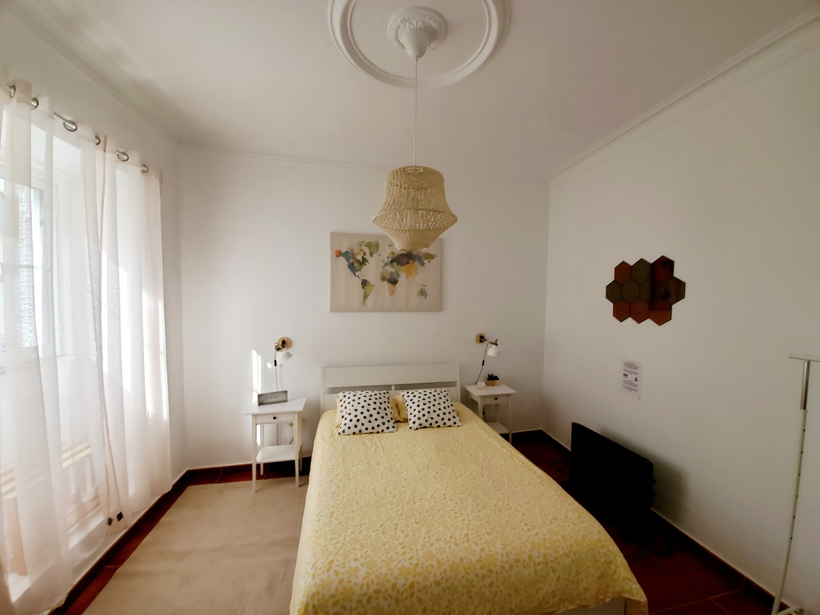Interior detail with woven hanging light and warm natural materials
